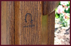 Close-up of table base, showing the Stickley branded signature used from 1912 to 1916.